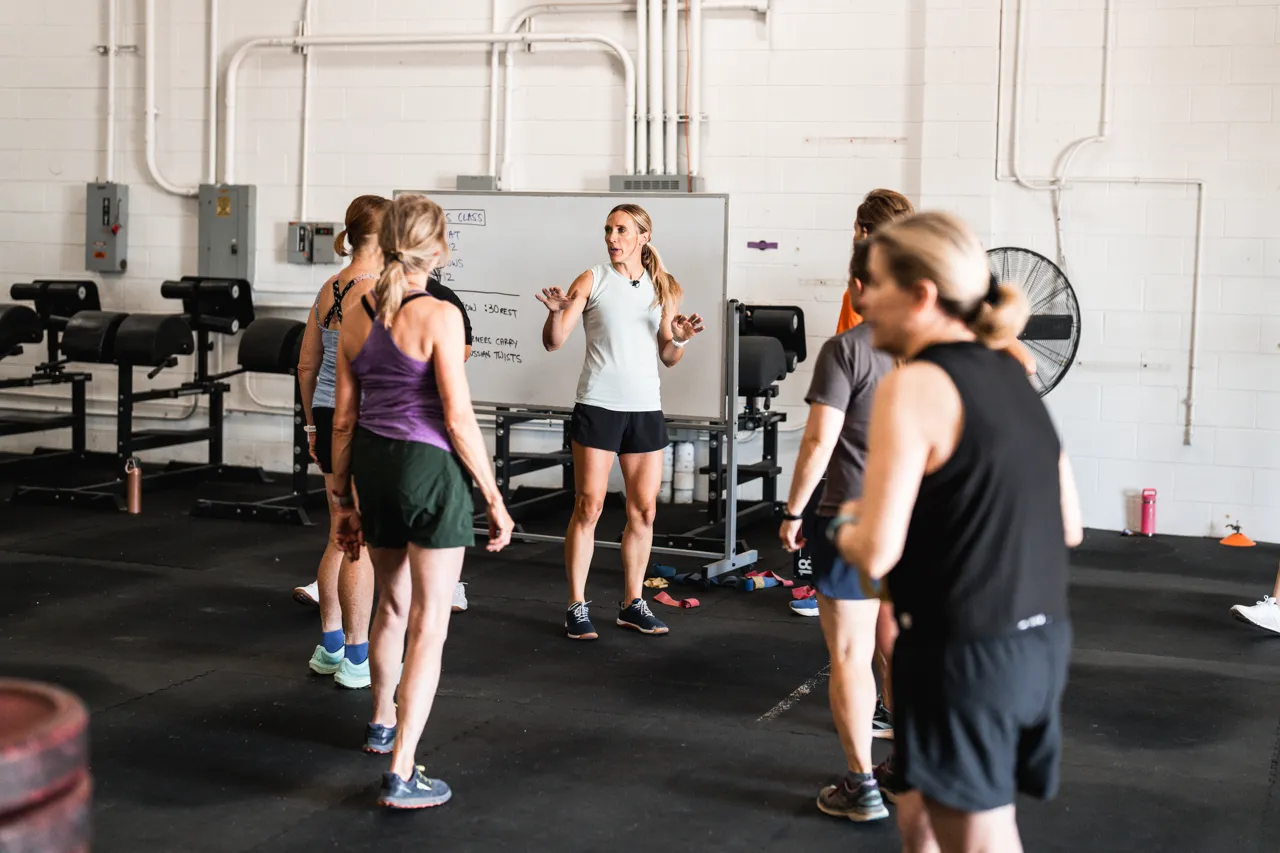 Empowered women strength training in a supportive gym environment for improved metabolic and cardiovascular health.