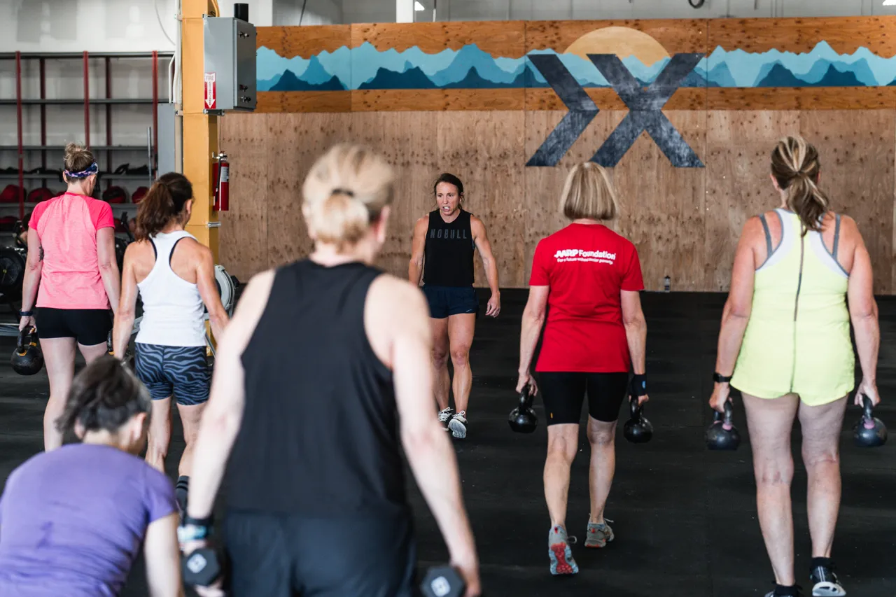 Dynamic group training session promoting women’s fitness, strength, and cardiovascular health.